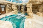 Waterfall grotto spa by clubhouse pool